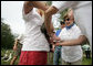 Mrs. Laura Bush tags an albatross chick during a visit to Midway Atoll Thursday, March 1, 2007. Interior Secretary Dirk Kempthorne is pictured with Mrs. Bush. President Bush designated the Northwest Hawaiian Islands National Monument on June 15, 2006, and is the single largest conservation area in U.S. history and the largest protected marine area in the world. White House photo by Shealah Craighead