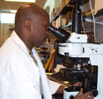 Microscopy is the established method for laboratory confirmation of malaria; here, a laboratorian at CDC’s reference diagnostic laboratory for parasitic diseases.