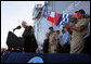 Vice President Dick Cheney gets a laugh from Navy commanders on stage as he makes a joke during an address to over 4,000 sailors and Marines from the flight deck of the amphibious assault ship USS Bonhomme Richard docked at Naval Station San Diego. White House photo by David Bohrer