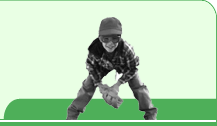 Young boy wearing a baseball cap and protective eyewear.