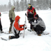 Students learning snow sampling data collection methods during Snow Survey School.