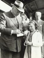 Former President Hoover signs an autograph. 1938-83