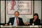 President George W. Bush holds the hand of Patty Couch during a roundtable discussion on Housing Counseling, Tuesday, July 1, 2008 at Family Service Agency Inc. in North Little Rock, Arkansas. White House photo by Joyce N. Boghosian