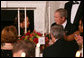 President George W. Bush shares a toast with Alma Powell, left, wife of former Secretary of State Colin Powell, Tuesday evening, Nov. 13, 2007 in the State Dining Room of White House, during a social dinner in honor of America's Promise-The Alliance for Youth. White House photo by Joyce N. Boghosian