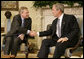President George W. Bush welcomes NATO Secretary-General Jaap de Hoop Scheffer to the Oval Office Friday, Oct. 27, 2006. White House photo by Kimberlee Hewitt