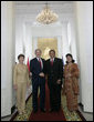 President George W. Bush and Mrs. Laura Bush are greeted by President Susilo Bambang Yudhoyono of Indoniesia and Herawati Yudhoyono at the Presidential Palace in Bogor, Indonesia, after arriving in the country for a six-hour visit Monday, Nov. 20, 2006.  White House photo by Eric Draper