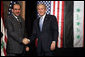 President George W. Bush and Prime Minister Nouri al-Maliki shake hands after a joint press availability Thursday, Nov. 30, 2006, in Amman, Jordan. The leaders later issued a joint statement in which they said they were, "Pleased to continue our consultations on building security and stability in Iraq."  White House photo by Paul Morse