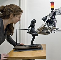 scientist with sculpture