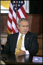 President George W. Bush takes part in a roundtable with Iraq provincial reconstruction team leaders in the Dwight D. Eisenhower Executive Office Building Thursday, March 22, 2007. "We don't want you to go into Iraq and then have unnecessary strings placed upon the money so you can't do your job," said the President to the press. "Congress needs to get their business done quickly, get the monies we've requested funded, and let our folks on the ground do the job." White House photo by Joyce N. Boghosian