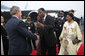 President George W. Bush is greeted by President Boni Yayi of Benin, and his wife, Madame Chantal de Souza Yayi, as he and Mrs. Laura Bush deplane Air Force One Saturday, Feb. 16, 2008, at the Cadjehoun International Airport in Cotonou, Benin. White House photo by Eric Draper