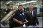 President George W. Bush talks with employees during his visit to ColorCraft of Virginia, Inc. Wednesday, March 26, 2008, in Sterling, Virginia. White House photo by Chris Greenberg