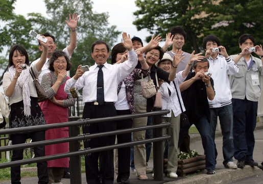 Crowds wave as the motorcade of the Mrs. Laura Bush travels to the Lake Toya Visitors Center Wednesday, July 9, 2008, in Hokkaido, Japan. White House photo by Shealah Craighead