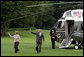 President George W. Bush and Mrs. Laura Bush wave Wednesday, July 9. 2008 on their arrival back to the White House, following their trip to the G-8 Summit in Japan. White House photo by Luke Sharrett