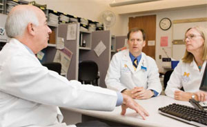 Neurologist David Fink (left), with VA and the University of Michigan, meets with UM oncologists Frank Worden and Susan Urba to discuss a study the group is leading on gene therapy for chronic pain in cancer patients