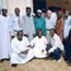 Vice President David Smock (center) meets with community leaders to resolve conflict in Nigeria.