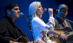 American Idol contestant and country musician Kellie Pickler and band mates Joshua Henson (left) and Ryan Ochsner perform for servicemembers, Dec. 16, during the 2008 USO Holiday Tour at Ramstein Air Base, Germany.