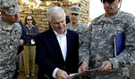 U.S. Defense Secretary Robert Gates receives a tour of one of the structures next to the Ziggurat of Ur, Iraq, Jan. 19, 2007.