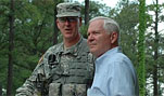 Defense Secretary Robert M. Gates and Brig. Gen. Daniel Bolger, commander of the Joint Readiness Training Center and Fort Polk, talk while on their way to observe training at the Joint Readiness Training Center and Fort Polk, La., May 4, 2007.