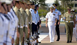 Navy Adm. Mike Mullen, chairman of the Joint Chiefs of Staff, reviews Australian servicemembers during a welcoming ceremony at Russell House,Canberra, Australia, Feb. 22, 2008.