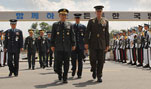 Marine Gen. Peter Pace, chairman of the Joint Chiefs of Staff, and his South Korean counterpart Gen. Kim Kwan-Jin walk between an honor cordon of South Korean troops toward the Korean Ministry of Defense in Seoul, Korea, Aug. 16, 2007.