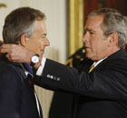 George Bush presents Tony Blair with a presidential medal of freedom