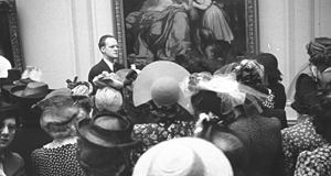 Lecturer presenting exhibition room tour, May 1941