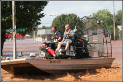 A search and rescue crew in an air boat look for residents that need help following severe flooding in Kingfisher, Oklahoma.  Patricia Brach/FEMA