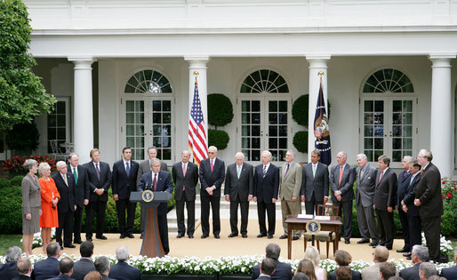 President George W. Bush delivers remarks prior to the signing of H.R. 6304, the Foreign Intelligence Surveillance Act Amendment Act of 2008, Thursday, July 10, 2008, in the Rose Garden of the White House. Joining President Bush at the signing ceremony are from left, Rep. Heather Wilson, R-N.M.; Rep. Jane Harman, D-Calif.; U.S. Attorney General Michael Mukasey; Director of National Intelligence Admiral Michael McConnell; Rep. Mike Rogers, R-Mich.; Rep.Darrell Issa, R-Calif.; Rep. Dan Lungren, R-Calif., Rep. Louie Gohmert, R-Texas; Utah Senator Orrin Hatch, Vice President Dick Cheney; Connecticut Senator Joe Lieberman; Arizona Senator Jon Kyl, Rep. John Boehner, R- Ohio; Rep. Pete Hoekstra, R- Mich.; Missouri Senator Kit Bond, Rep. Roy Blunt, R-Mo.; Rep. Silvestre Reyes, D-Texas; Rep. Lamar Smith, R-Texas; and West Virginia Senator Jay Rockefeller. White House photo by Chris Greenberg