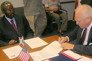 USADF President Lloyd Pierson signs grants agreements for Ambassador Niyongabo 