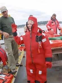 NOAA Teacher at Sea, Kimberly Pratt in Gumby Suit, while aboard the McARTHUR II