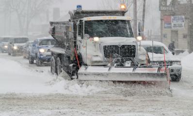 snowplow clearing city streets