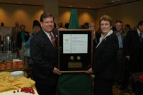 Public Printer Robert C. Tapella presents the Federal Depository Library of the Year Award to Betty Murr of the Middendorf-Kredell Branch of the St. Charles City-County Library District at a ceremony in Washington D.C.  The library is located outside of St. Louis, MO.