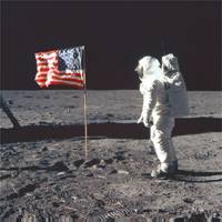 Buzz Aldrin on the moon poses next to the Unites States flag, July 20, 1969