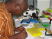 Photo of a scientist conducting research at the National Institutes of Health (NIH) Malaria Research and Training Center (MRTC) in Bamako. (click here to see more)
