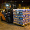 A member of the Texas Forest Service moves pallets of water in a warehouse in Lufkin, TX that is being used to handle basic supplies of water and MRE (meals ready to eat) for distribution to affected residents. Photo by Patsy Lynch/FEMA