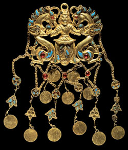 One of a pair of pendants showing the "Dragon Master," Tillya Tepe, Tomb II, Second quarter of the 1st century AD Gold, turquoise, garnet, lapis lazuli, carnelian and pearls National Museum of Afghanistan Photo © Thierry Ollivier/Musée Guimet