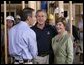 NBC "Today Show" host Matt Lauer talks with President George W. Bush and Laura Bush Tuesday, Oct. 11, 2005, on the construction site of a Habitat for Humanity home in Covington, La., a hurricane-devastated town just north of New Orleans where the nonprofit is building houses for those displaced by Katrina. White House photo by Eric Draper