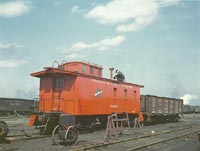 Putting the finishing touches on a rebuilt caboose