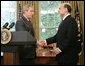 President George W. Bush shakes the hand of Ben Bernanke after announcing his decision to nominate Mr. Bernanke as Chairman of the Federal Reserve, replacing Alan Greenspan upon his retirement in January 2006. The announcement came Monday, Oct. 24, 2005, in the Oval Office. White House photo by Paul Morse