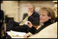 White House Counsel Harriet Miers sits in the Oval Office July 1, 2005, as President George W. Bush speaks on the phone in the background. White House photo by Eric Draper