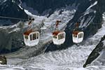 Photo: Cable cars in snowy mountains