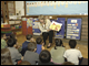 Secretary Spellings talks with students at Humboldt Park Charter School in Milwaukee, Wisconsin.  During the visit, Spellings presented an Early Reading First grant to Marquette University that will benefit students in the Milwaukee area.