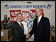 Lt. General Pete Osman, USMC (ret.), President and CEO of the Marine Toys for Tots Foundation, thanks Deputy Secretary Ray Simon for the Department's donation of 12,000 books through the 2008 Holiday Book Donation.