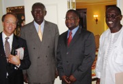 (Left to Right) ADF Board Chair Ward Brehm, Ghana President John Kufuor, ADF President Nathaniel Fields and Ghana's Minister for Private Sector Development, Kwamena Bartels, celebrate the signing of a new five-year strategic partnership for small business investment at the Willard Hotel in Washington, DC on June 15, 2005.