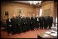 President George W. Bush stands with U.S. Supreme Court Chief Justice John Roberts, as they pose for photos with U.S. Supreme Court Associate Justices, from left to right, Justice Ruth Bader Ginsburg, Justice David H. Souter, Justice Anthonin Scalia, Justice John Paul Stevens, Justice Sandra Day O'Connor, Justice Anthony Kennedy, Justice Clarence Thomas and Justice Stephen G. Breyer, during the investiture ceremony for Chief Justice Roberts, Monday, Oct. 3, 2005 at the Supreme Court in Washington. White House photo by Eric Draper