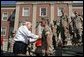 Vice President Dick Cheney pins the Purple Heart Medal onto U.S. Marine CPL Daniel Foot during a rally at Camp Lejeune in Jacksonville, NC, Monday, October 3, 2005. The Vice President presented five Marines with medal at that time. White House photo by David Bohrer