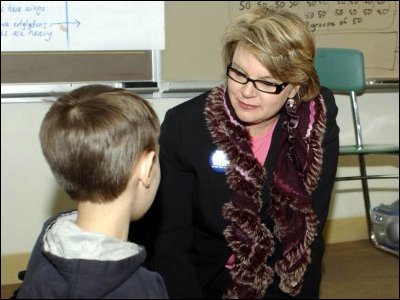 Secretary Spellings talks with a student at Holmes Elementary School in Spokane, Washington.