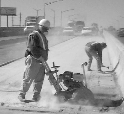 Worker using an industrial saw