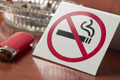 photo of a "no smoking" sign next to ashtray