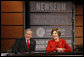 President George W. Bush and Mrs. Laura Bush react during a question and answer session Monday, Dec. 1, 2008, at the Saddleback Civil Forum on Global Health at the Newseum in Washington, D.C. White House photo by Eric Draper